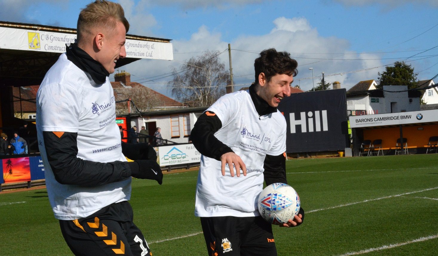 Two football players laughing