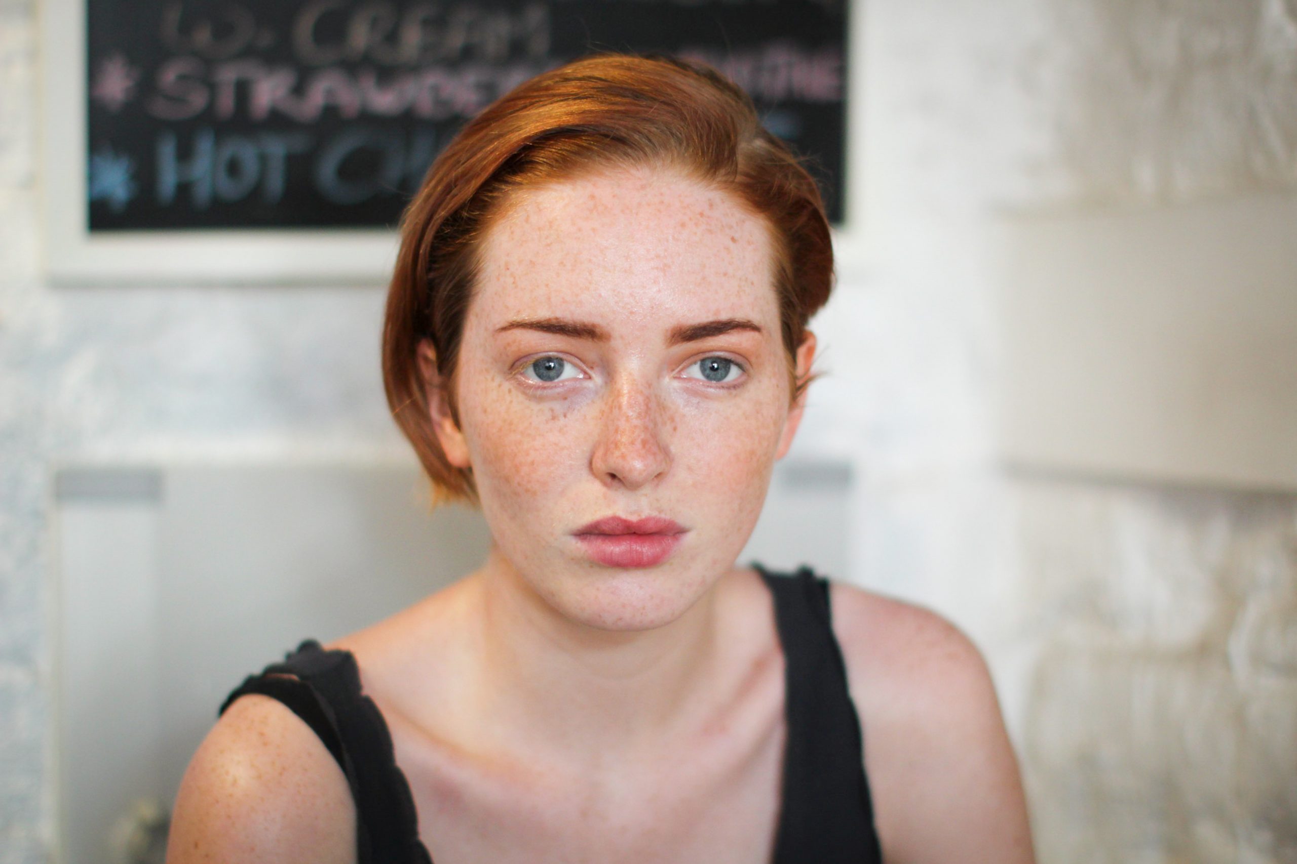 Red haired person looking at the camera