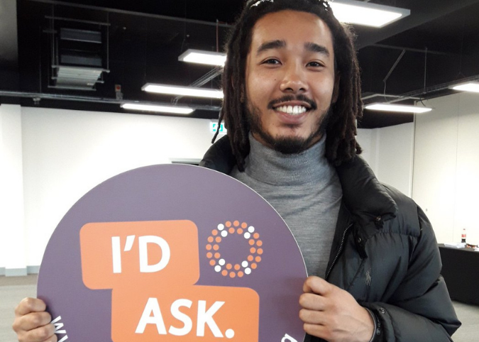 A man with a STOP Suicide banner