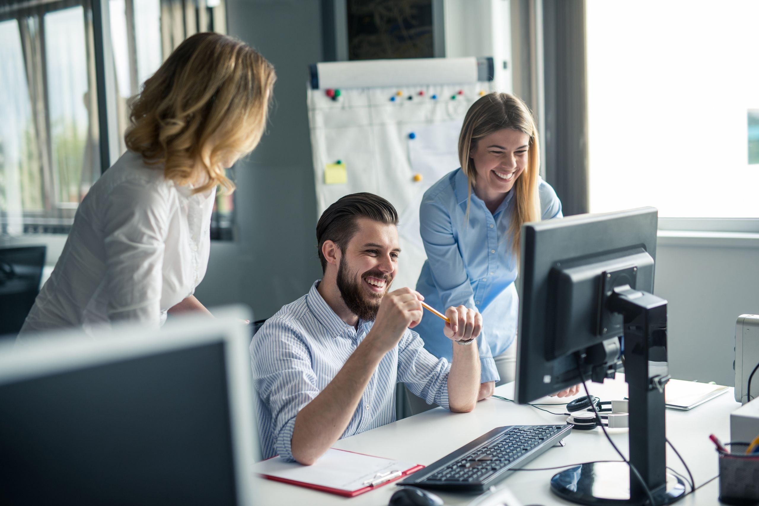 Three people in an office