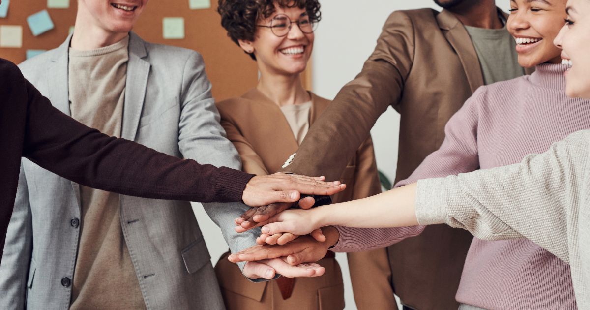 A group of people joining hands - Employee Relations Co-ordinator