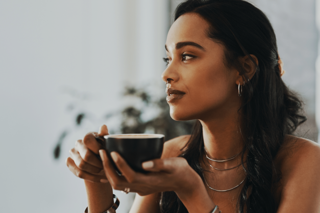 Mindfulness course at CPSL Mind - woman holding cup facing to the side with plant in background