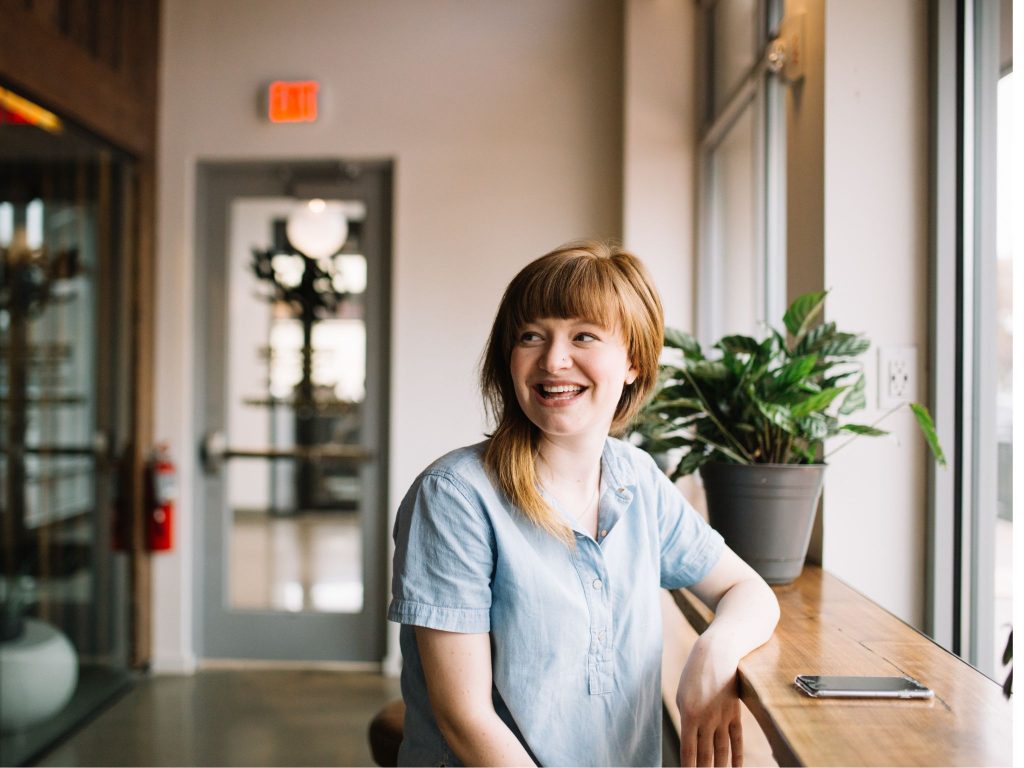 Smiling woman by a window